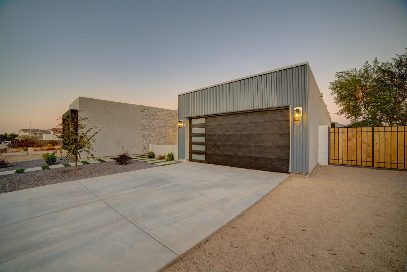 Modern new build home exterior at dusk